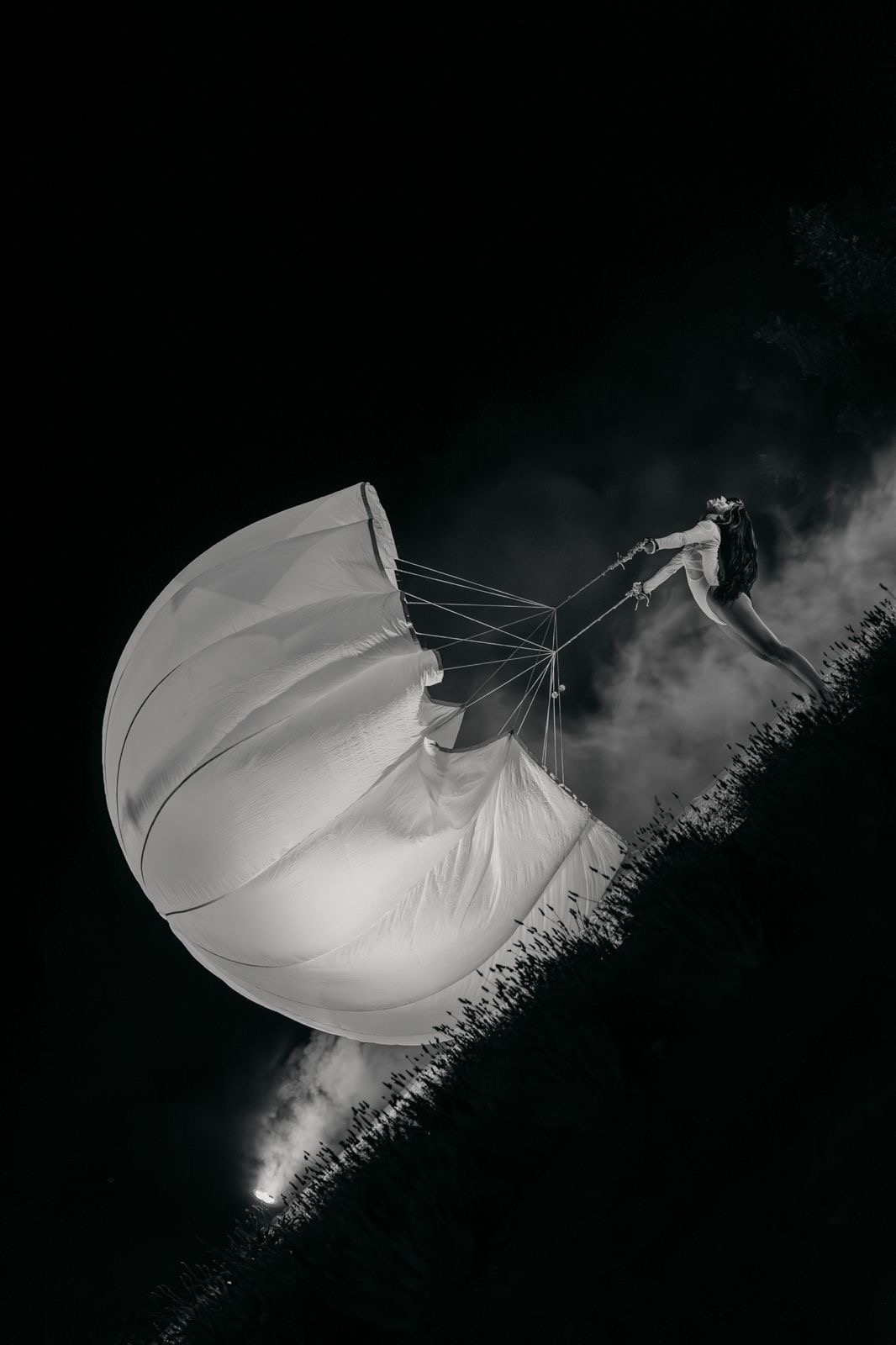 Aerial performer suspended above an outdoor event