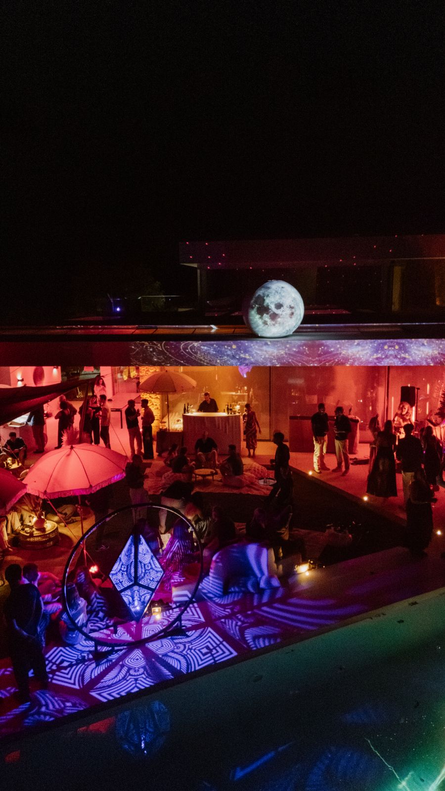 Immersive event space beneath an illuminated moon